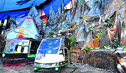 A Janmashtami procession depicts the flash flood disaster and rescue operations by armed force personnel in Haridwar on Wednesday