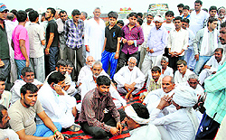 Irate villagers stage a dharna on the Jhajjar-Rohtak highway at Dighal village on Wednesday