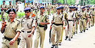 police personnel stage a flag march in Gurgaon on Wednesday