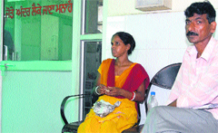 Soni waits for her turn at the local Civil Hospital even as she carries a dead child in her womb in Jalandhar on Wednesday. Tribune Photo: Malkiat Singh
