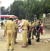 CRPF and police personnel cordon off the Awantipora market in Pulwama district on Wednesday. 