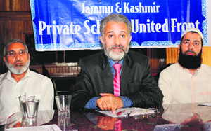 J&K Private Schools United Front general secretary Ghulam Nabi Var addresses a press conference in Srinagar on Wednesday.