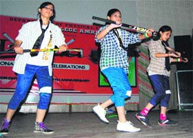 Students perform during the birth anniversary celebrations of Dhyan Chand
