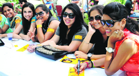 Supporters of the Students Organisation of India design party stickers for the student council elections at Panjab University in Chandigarh on Thursday.