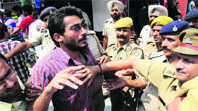 the police disperses the crowd after supporters of two parties entered into an altercation at Panjab University in Chandigarh on Thursday