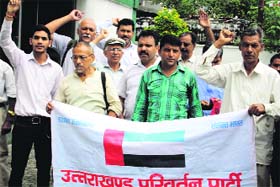 UPP members hold a protest in front of the office of the Commissioner, Excise, in Dehradun on Thursday