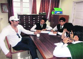 Actor Nawab Shah interacts with students at Wynberg Allen School in Mussoorie on Thursday
