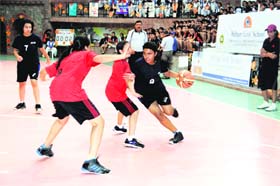 Players in action during a match in the All-India Basketball Tournament for Girls under way at Welham Girls School in Dehradun on Thursday