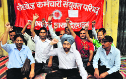 Roadways employees hold a dharna in support of their demands in Dehradun on Thursday. A Tribune photograph