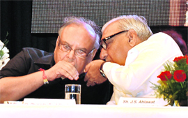 Chief Minister Bhupinder Singh Hooda shares a point with Justice Vijender Jain, chairman, Haryana Human Rights Commission, during a seminar in Gurgaon on Thursday. 