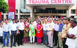Doctors hold a demonstration in front of the Civil Hospital in Karnal on Thursday. 