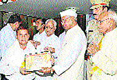 Governor Jagannath Pahadia honours Dr Hari Prakash Sharma, Associate Professor, Guru Nanak Khalsa College, Yamunanagar, at the Haryana Raj Bhawan in Chandigarh