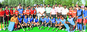 Haryana Sports and Youth Affairs Departments Principal Secretary Amit Jha (standing first row, seventh from right) with women hockey players at the Hockey Sports Academy, Shahbad
