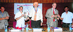 KU Vice-Chancellor Lt Gen (retd) DDS Sandhu (centre) and Donald Kirk (second from right) release the book "Indian Foreign Policy" written by Prof Rajbir Singh Yadav, Chairman, Political Science Department, in the University Faculty Lounge