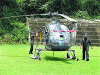 An Army helicopter arrives at the Police Ground in Dharamsala on Thursday. 