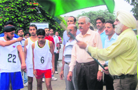 University of Jammu Vice-Chancellor Prof MPS Ishar flags off the inter-collegiate cross-country championship in Jammu on Thursday.