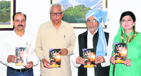 Governor NN Vohra releases a book in Srinagar on Thursday.