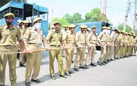 Policemen deployed to stop the protesters in Srinagar on Thursday.