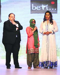 Standing tall: Sonali Mukherjee (centre)