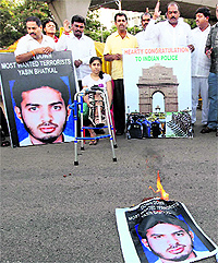 Members of the Youth Congress burn a poster of Yasin Bhatkal in Bangalore on Thursday