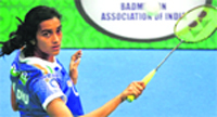 P V Sindhu of Awadhe Warriors plays a shot against Tine Baun of Mumbai Masters during the second semifinal of the Indian Badminton League at Kanteerava stadium in Bengaluru on Thursday.  PTI 
