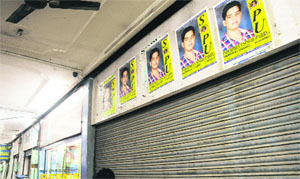 Posters pasted on a shop at a market in Chandigarh. 