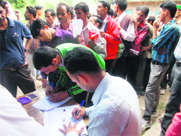 Members of of the Delhi Diocese of Mar Thoma Church distribute releif material among the disaster-affected villagers of Kyari in Mussoorie