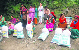 villagers with bags carrying food material. 