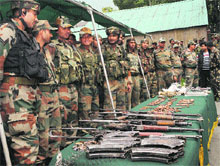 The Army displays arms and ammunition recovered from militants in Ganderbal district on Friday.