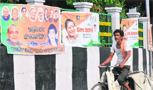 Posters of the Congress and the BJP put up in Jammu on Friday ahead of party meetings.
