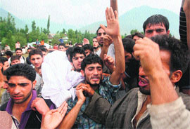 Villagers carry the body of one of the slain militants during his funeral at Preng in Kangan on Friday.