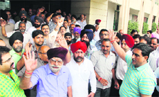 Members of the Jalandhar Industrial and Traders Action Committee walk out of the venue before the visit of Chief Parliamentary Secretary SC Singla in Jalandhar on Friday.