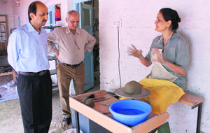 Dara Shikoh Centre for Art director Jyotsna Singh works on a potters wheel in Srinagar on Friday. 