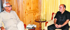 Governor NN Vohra with Jammu and Kashmir Peace Foundation chairman Fayaz Ahmad Bhat in Srinagar on Friday. 
