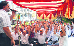 Bank employees stage a dharna in Ludhiana on Friday. Photo: Inderjeet Verma