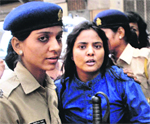 The police detains a protester in Mumbai on Friday.  PTI 
