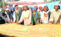 Muslim devotees offer the holy 'Chaddar' at the Subrahati Shah Baba shrine in BHEL, Haridwar, on Saturday . Tribune photo: Rameshwar Gaur
