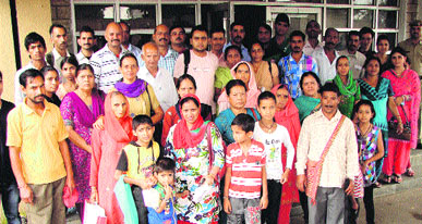 People from surrounding villages protest outside the DC office at Dharamsala on Saturday.