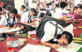 A schoolgirl participates in a painting competition organised by the JCI Club in Jalandhar on Saturday.