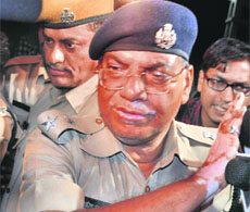 A senior officer of the Jodhpur police arrives at Asarams ashram in Indore on Saturday night. 