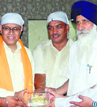 FCI CMD C Vishwanath (left) being felicitated by SGPC officials in Amritsar on Saturday. 