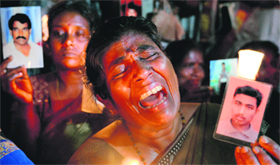 A Sri Lankan activist during a candlelight vigil in Colombo held to mark the International Day of the Disappeared.