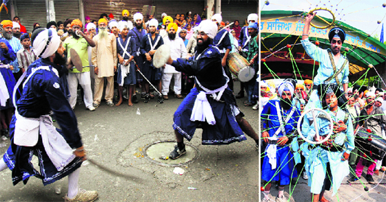Sikh youths perform martial art Gatka at a religious procession at the Golden Temple to mark the 409th anniversary of installation of Sri Guru Granth Sahib in Amritsar on Sunday.