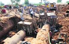 Repairs on the damaged pipeline in final stages at Gharuan on Sunday. 