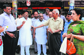 Residents hold a meeting to discuss the problem of safety of elderly persons at a market in Sector 7, Panchkula, on Sunday.