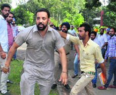 Estranged student leader Gurinder Minhas creates ruckus at the tent pitched by Panjab University Students Union on the campus.