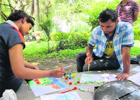 Activists of the Making a Difference by Being the Difference at the painting exercise in Gandhi Park, Dehradun, on Sunday