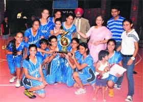 Winning team members of Modern School, New Delhi, with their trophy in Dehradun on Sunday