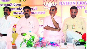Members of the BJP NGO cell take part in the concluding session of its two-day convention at Bhoopatwalain Haridwar on Sunday. 
