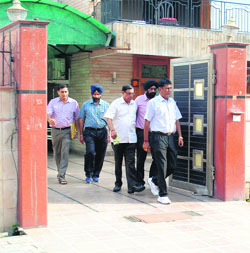 CBI officers come out after raiding the residence of former Transport Minister and MLA Om Prakash Jain at Model Town in Panipat in connection with former sarpanch Karam Singhs murder case. 